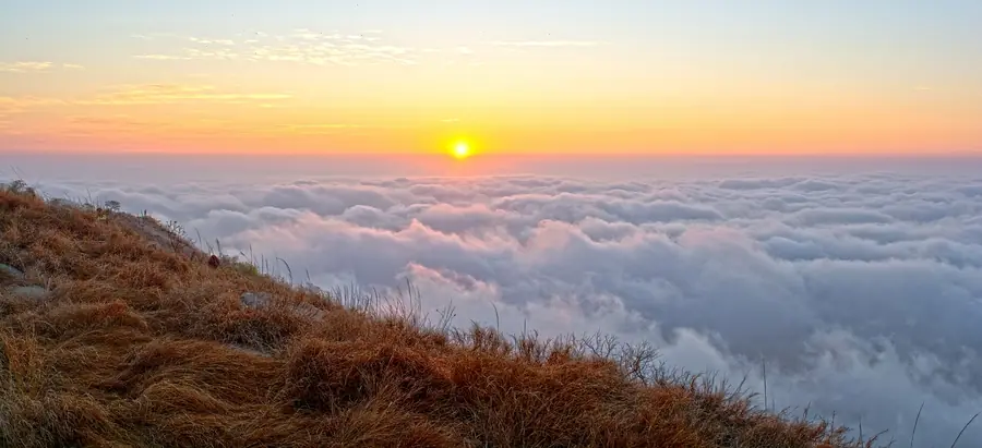Sunrise over a sea of clouds at Nandi Hills
