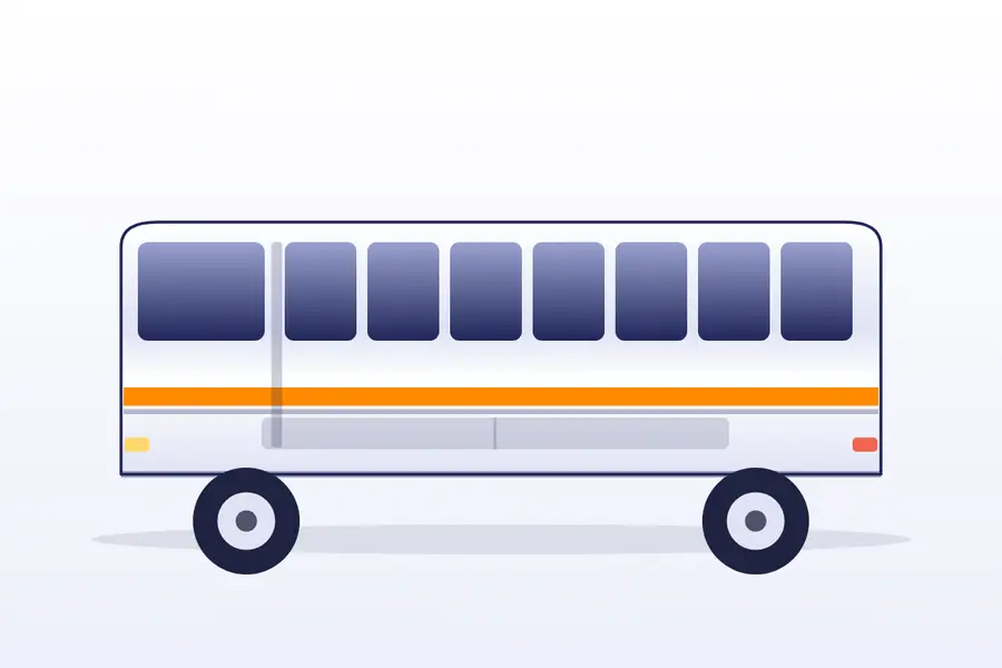 White and blue AC coach parked under trees